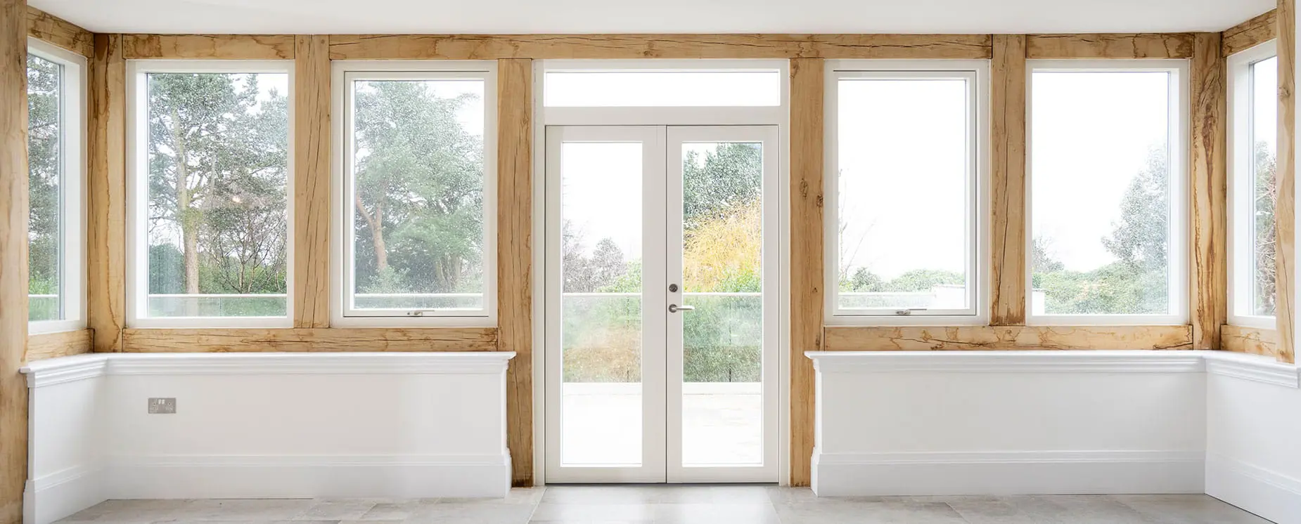 Timber frame extension featuring alu-clad timber windows, Heswall