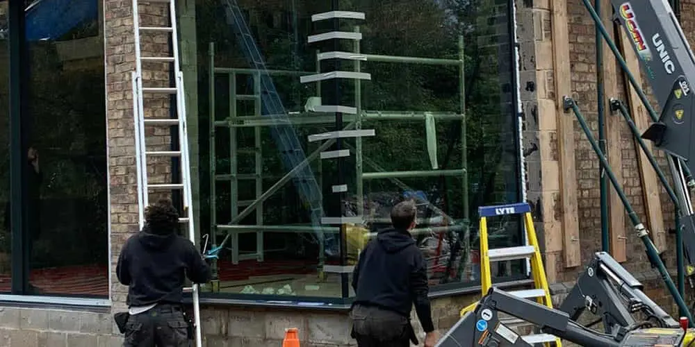 Taped up glass corner with 2 fitters